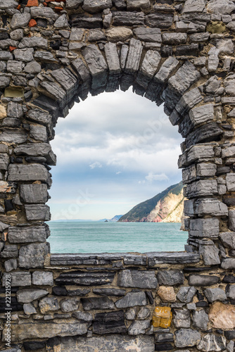 Billede på lærred Sea view from a stone window of an old ruin castle wall in Portovenere, Liguria, Italy