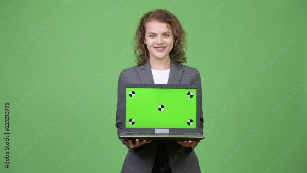 Young happy beautiful businesswoman showing laptop Young happy beautiful businesswoman showing laptop