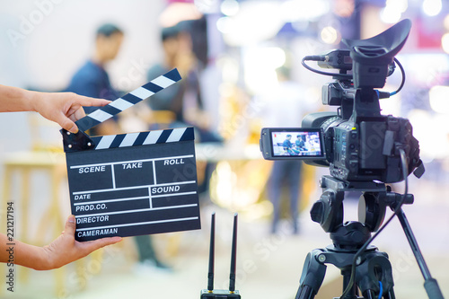 Wallpaper Mural Man hands holding movie clapper.Film director concept.camera show viewfinder image catch motion in interview or broadcast wedding ceremony, catch feeling, stopped motion in best memorial day concept. Torontodigital.ca