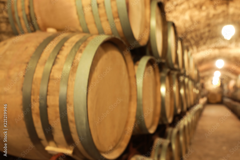 Large wooden barrels in wine cellar, closeup