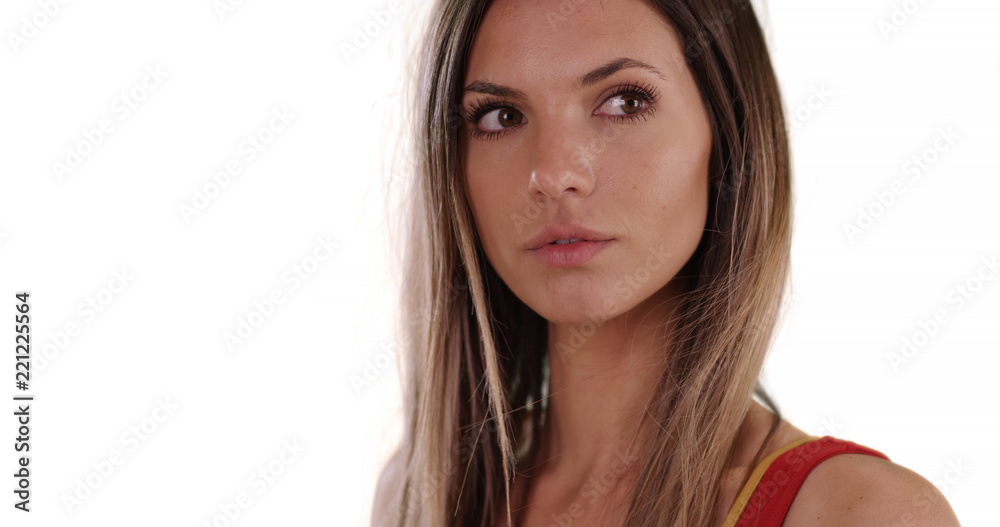 Close-up portrait of brunette with wind blowing hair on white copy space Close-up portrait of brunette with wind blowing hair on white copy space