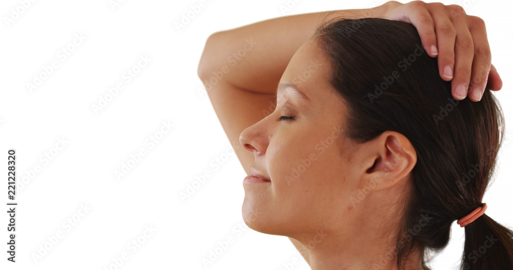 Side view of pretty Caucasian woman with eyes closed peacefully in studio Side view of pretty Caucasian woman with eyes closed peacefully in studio