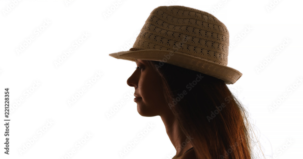Silhouette of young woman in fedora on white background Silhouette of young woman in fedora on white background