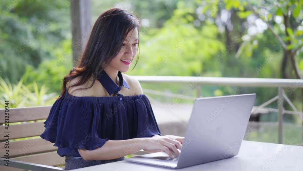 happy woman using laptop computer