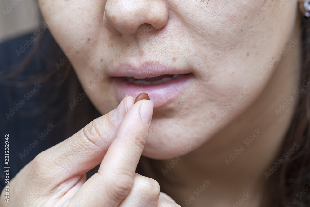 woman drinks pills woman drinks pills