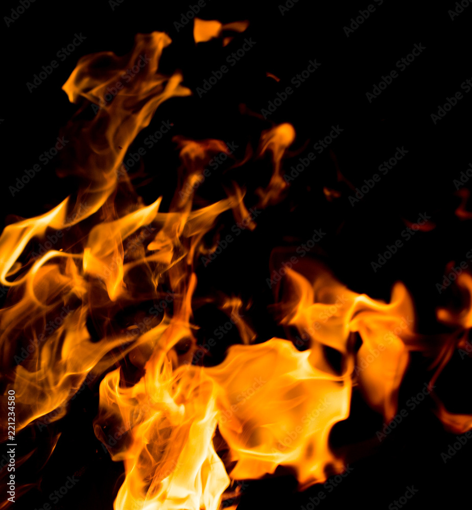 Flame of fire with sparks on a black background Flame of fire with sparks on a black background