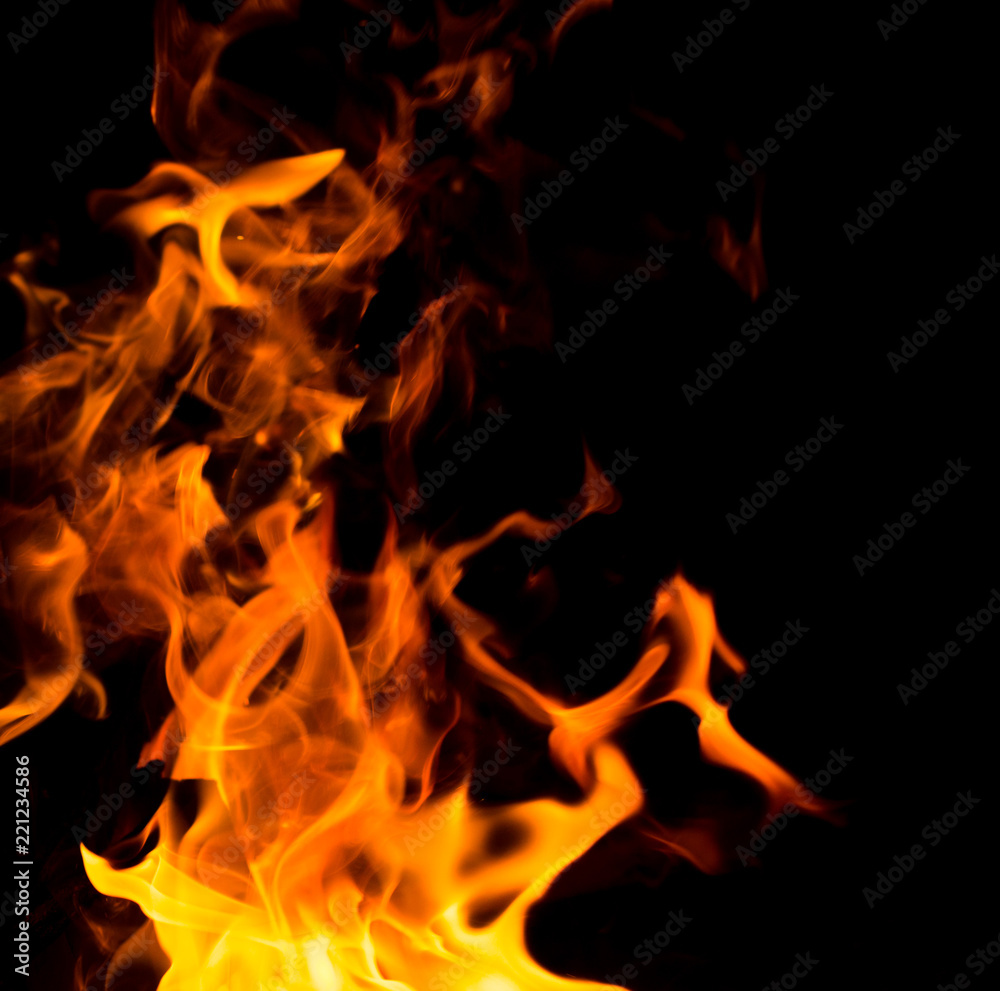 Flame of fire with sparks on a black background Flame of fire with sparks on a black background