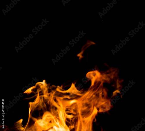 Flame of fire with sparks on a black background