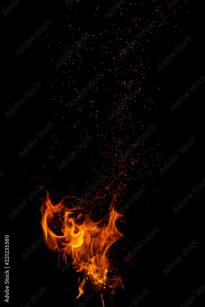 Flame of fire with sparks on a black background Flame of fire with sparks on a black background