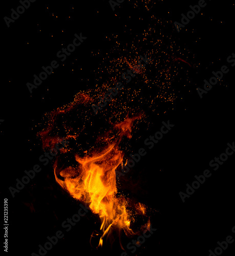Flame of fire with sparks on a black background