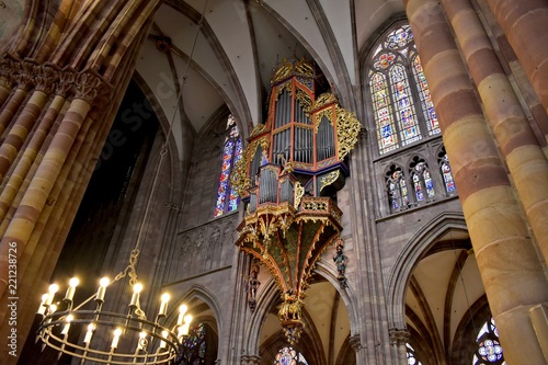 Strasbourg  Alsace  France - July 11  2018  Cathedral Notre-Dame of Strasbourg interior. Great pipe organ and chandelier.