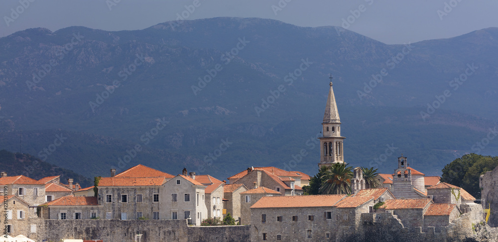 View of the old town of Budva in Montenegro against the background of blue-green mountains