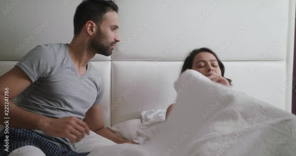 Man Trying Sexual Approach With Woman In Bed At Home Man Trying Sexual Approach With Woman In Bed At Home