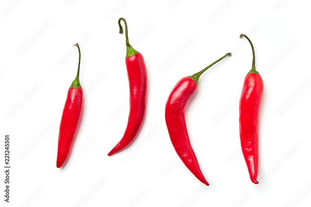 Red chili pepper on a white background. Red chili pepper of different shapes isolated on white background Red chili pepper on a white background. Red chili pepper of different shapes isolated on white background