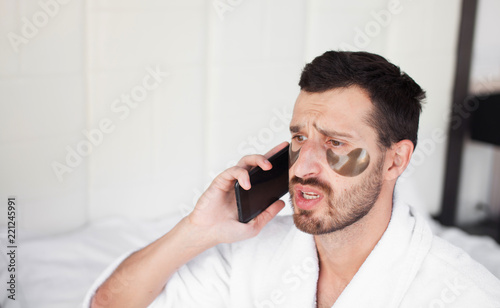 Man making some important calls after waking up