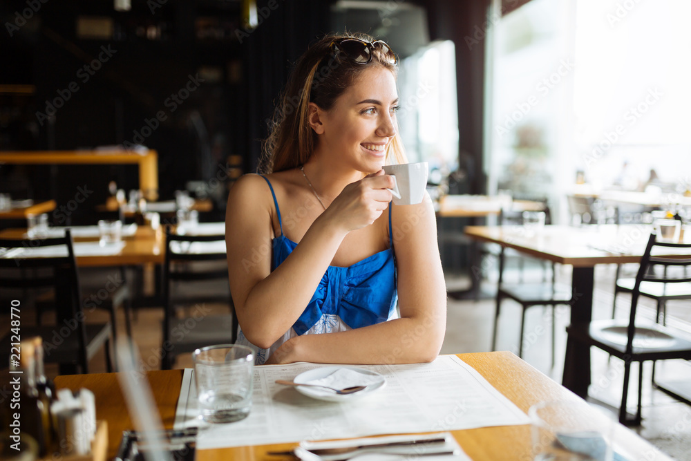 Stunning woman enjoying her coffee Stunning woman enjoying her coffee