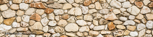 Stone wall texture background, panorama of masonry