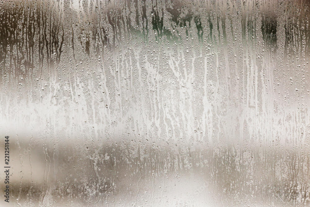 Wetted glass on the window as a background Wetted glass on the window as a background