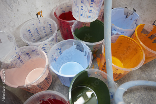 Vibrant, multicolor paint in buckets photo