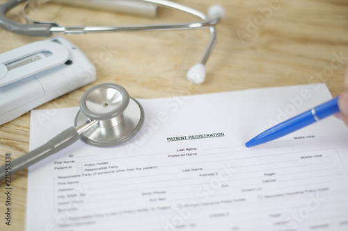 Personal perspective patient filling out medical patient registration form photo