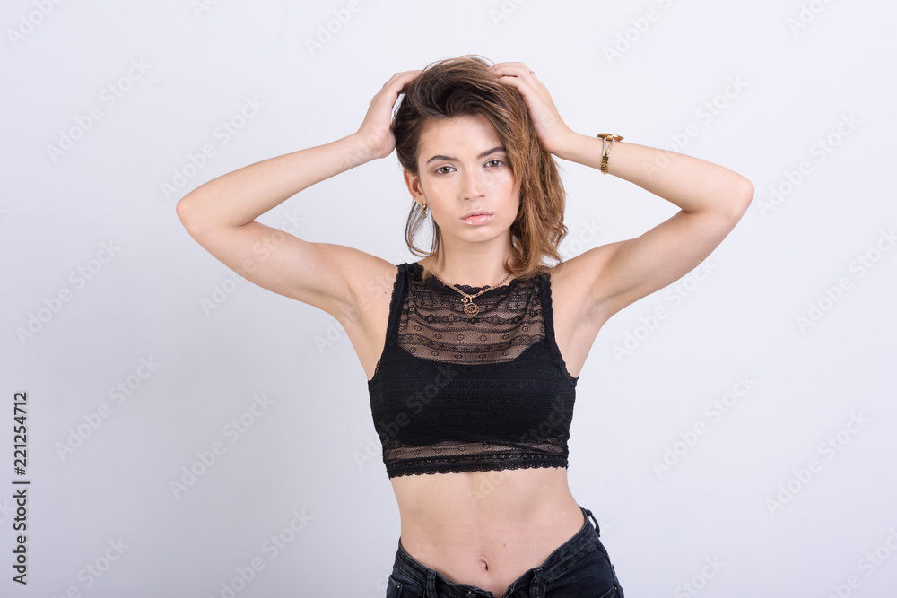 girl in black top on a white background girl in black top on a white background