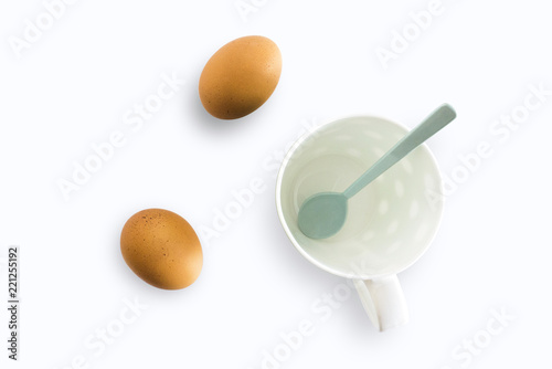 White cup and eggs separated from the white background with clipping path