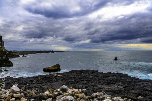 Rugged Icelandic Atlantic Ocean coastline and stormy seas photo