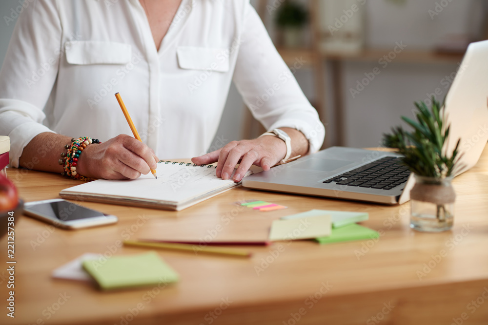 Instructor With Notebook Teacher with laptop on her table taking notes in planner Stock Photo ...