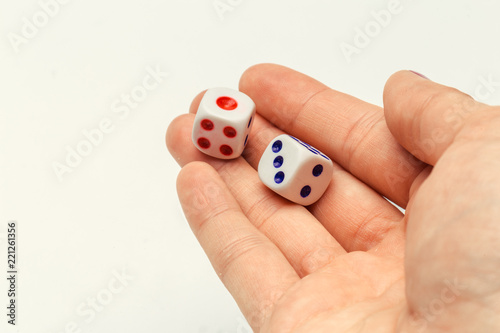 hand with a pair of dice