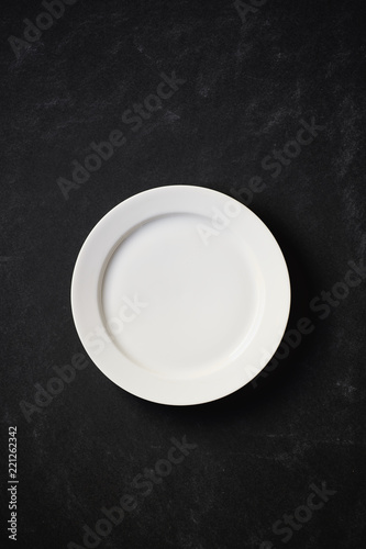 White plate in black background