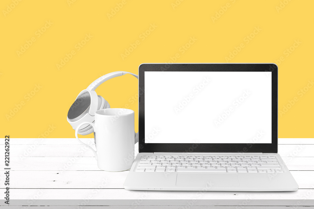 Fototapeta premium New headphones and laptop on the table