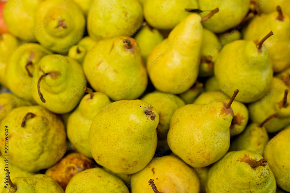 Pears in a box on the market. Pears in a box on the market.