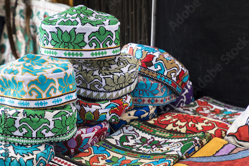 The traditional Uzbek cap named tubeteika, decorated with multi colored embroidery. Bukhara, Uzbekistan, Central Asia © Curioso.Photography