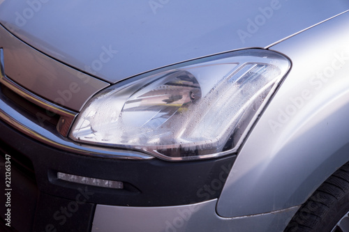 gray car headlight. © Denis Tsemashko