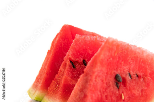 Pieces of red juicy watermelon sliced with a knife