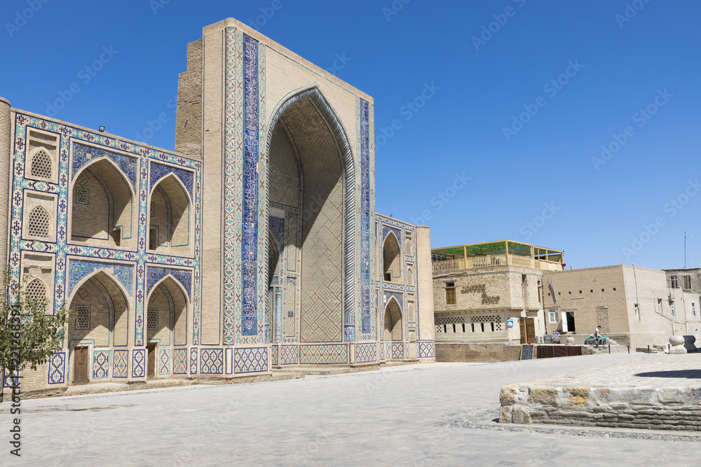 Madrasa facade in Bukhara, Uzbekistan.Traditional architecture.