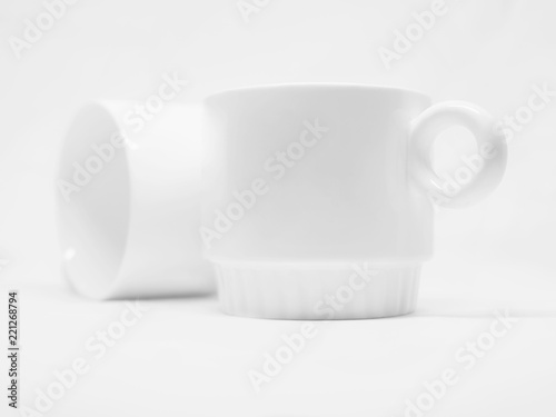 Schilderij op canvas Two blank white mugs isolated on a white background