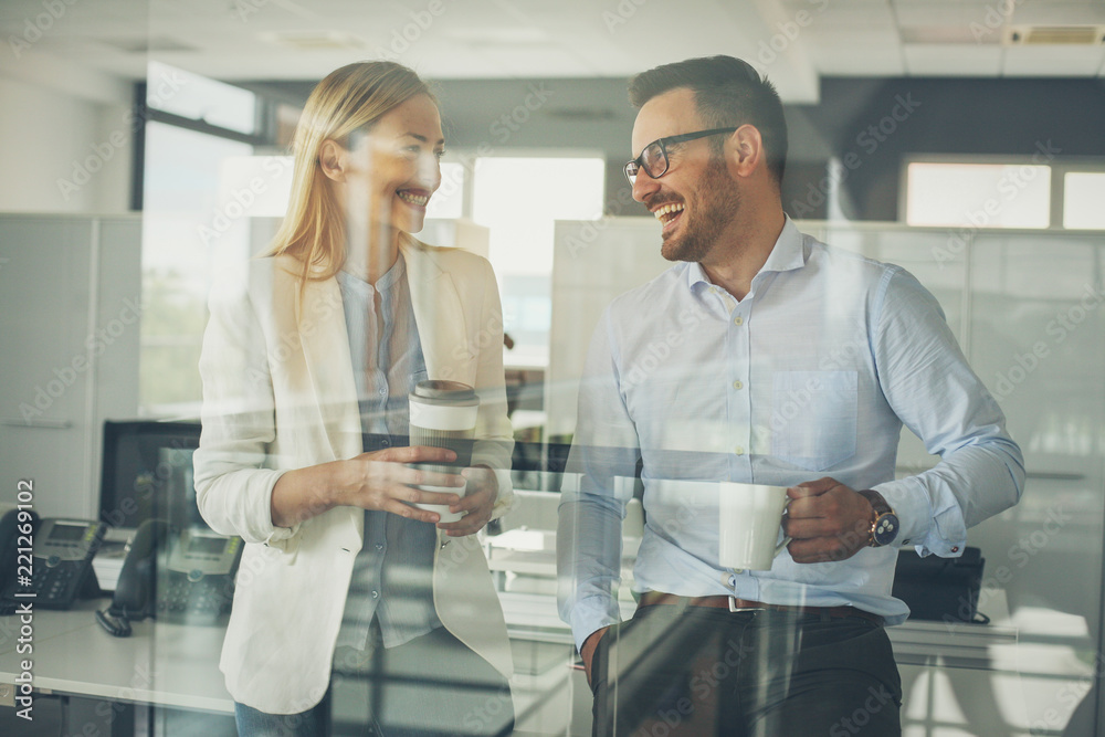 Fototapeta premium Business people standing in office and having break , time for coffee.