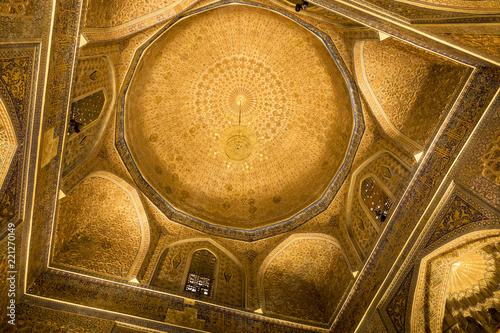 Amir Temur (Tamerlan) tomb in Samarkand, Uzbekistan. Wall's and ceiling golden mosaic decoration in Persian and Arabic ornaments and writing, Samarkand. photo