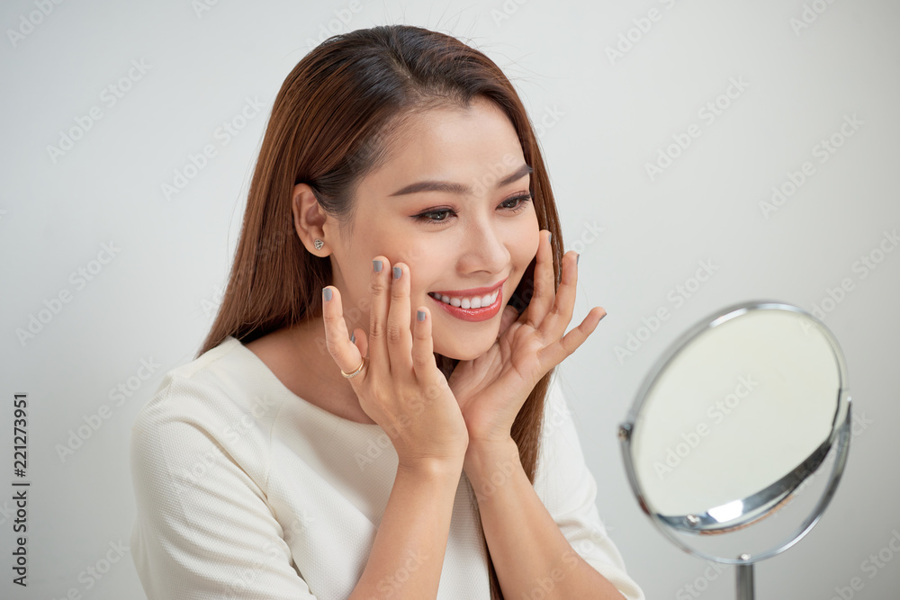 face of young beautiful healthy woman looking in the mirror face of young beautiful healthy woman looking in the mirror