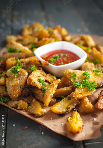 Close-up of roasted potatoes with rosemary, Parmesan cheese and fresh parsley on top