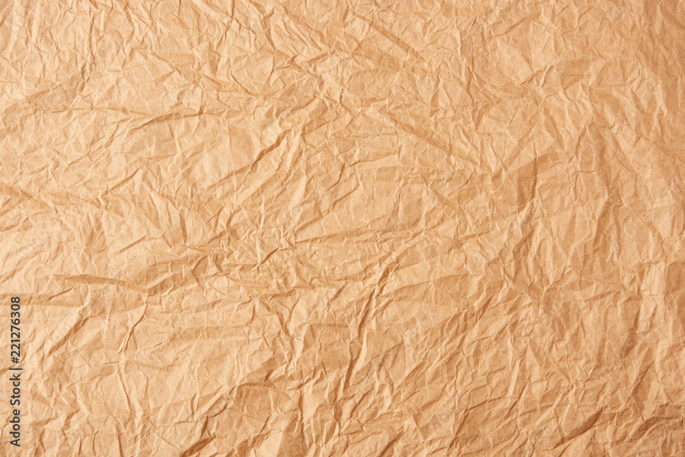 full frame of beige crumpled paper as background full frame of beige crumpled paper as background