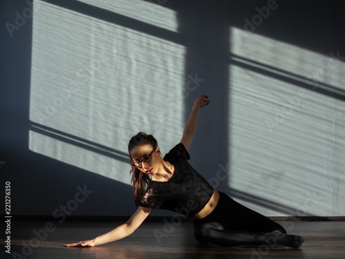Photography A young girl is engaged in jazz modern dance in the hall.