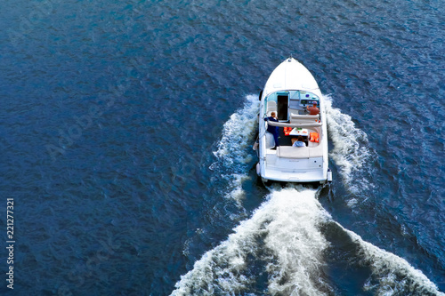 speedboat on the water in summer, back view