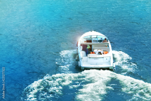 speedboat on the water in summer, back view