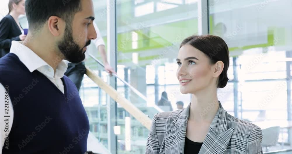 Business People. Man And Woman Talking At Work In Office