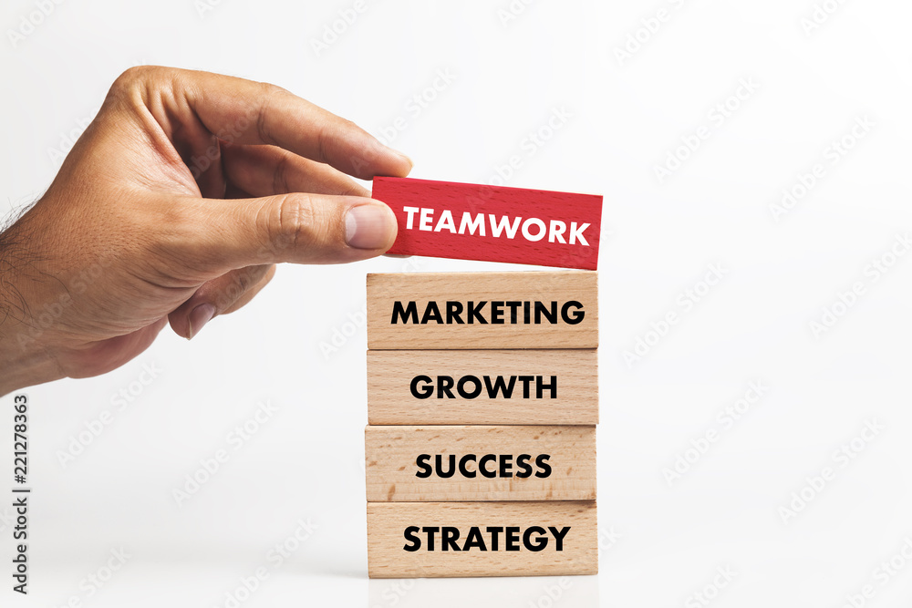 Businessman Building TEAMWORK concept with Wooden Blocks Businessman Building TEAMWORK concept with Wooden Blocks