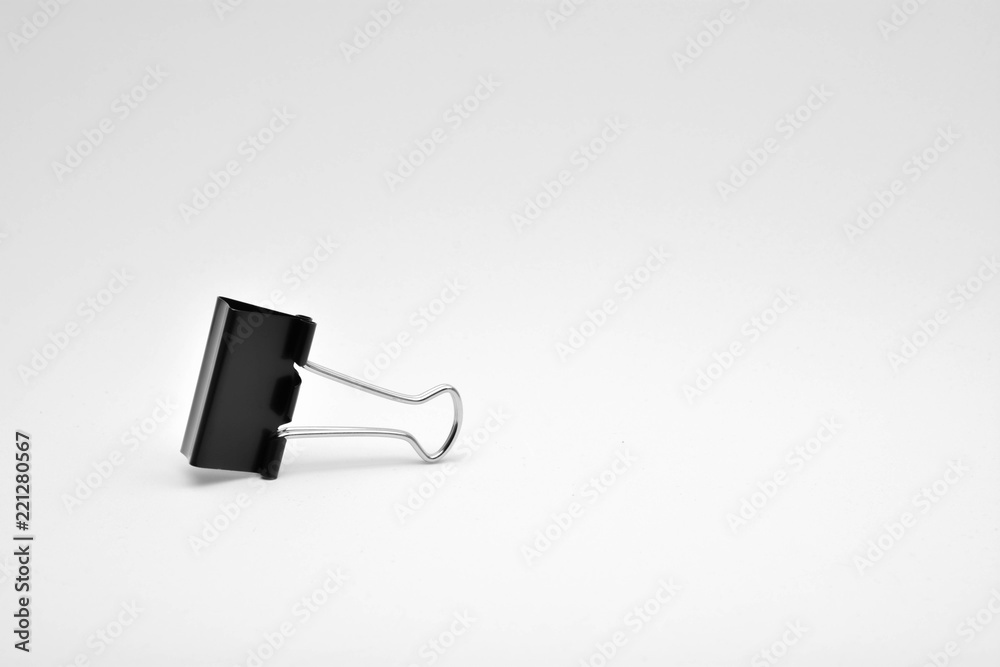 Obraz premium Black paper clip isolated on white background.