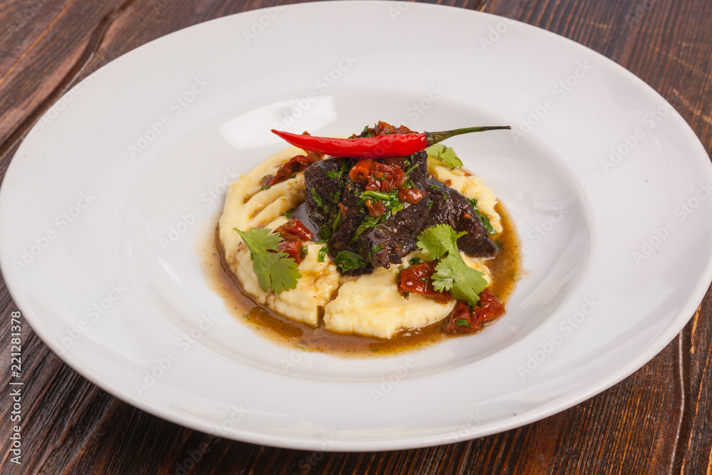 Beef with mashed potatoes and meat sauce Beef with mashed potatoes and meat sauce