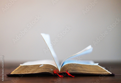 Bible books on wood table.